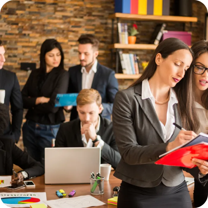 Business team collaborating in an office setting.