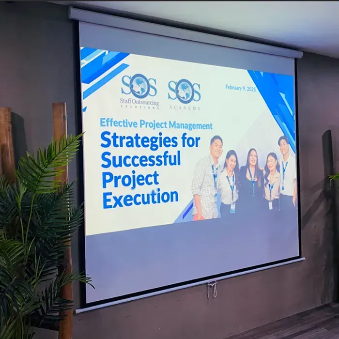 Projection screen displaying a project management seminar slide.