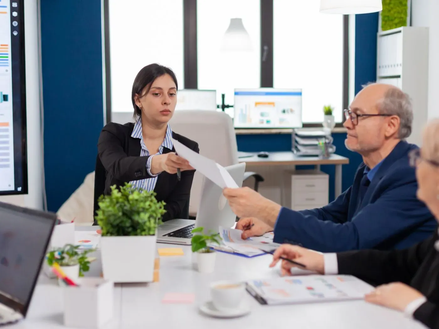 Business team discussing a project around a meeting table