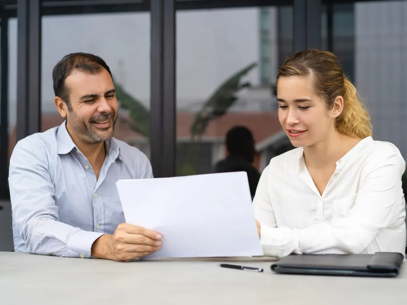 Business owner reviewing documents with a finance expert